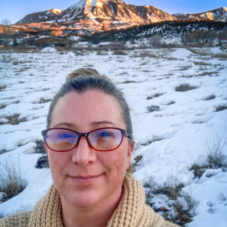 photo of Heidi Hudek in front of Lamborn mountain at Sunset